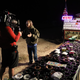 A film crew interviews an Area 51 ashtray vendor.